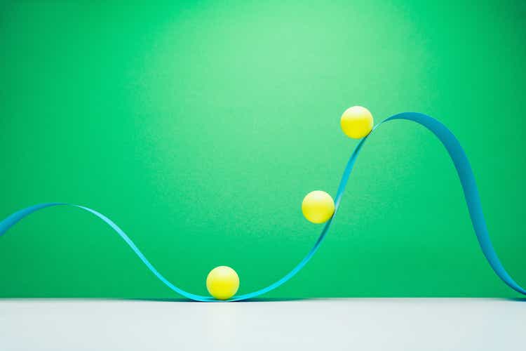 Abstract, yellow balls on blue wave