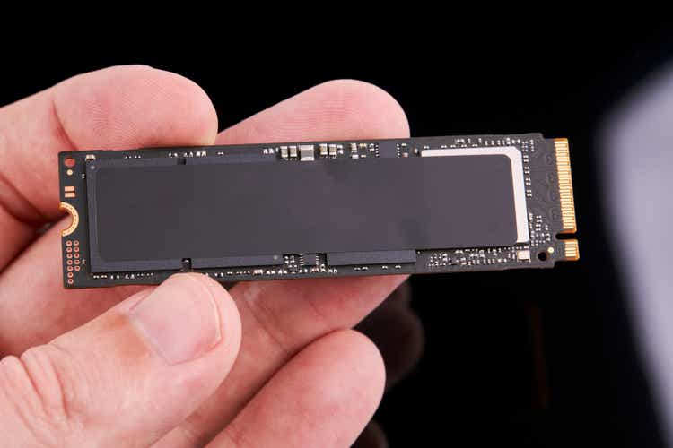 M.2 NAND SSD solid state drive technology. engineer person hold hardware device to upgrade desktop or laptop.