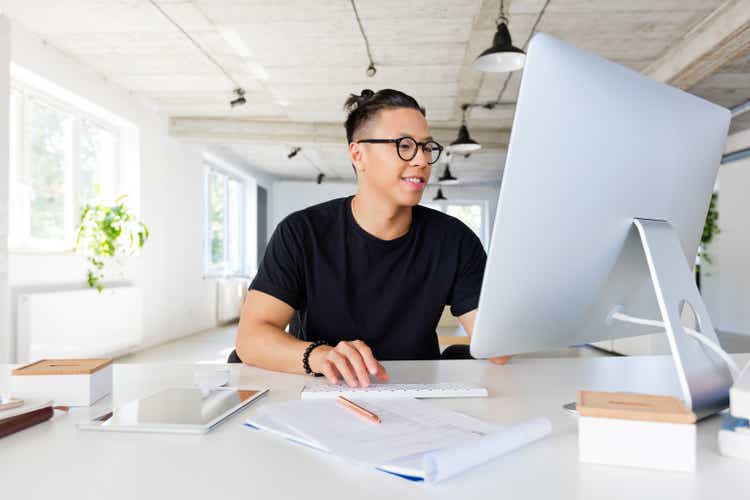 Handsome asian man working in the creative workplace