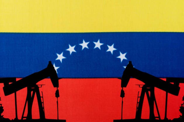 Oil pump on the background of the flag of Venezuela.