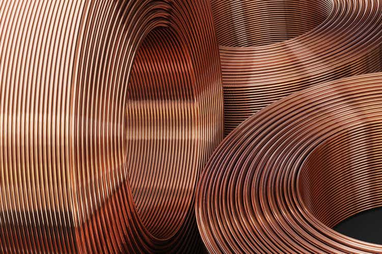 A close-up of a new and shiny copper pipe.