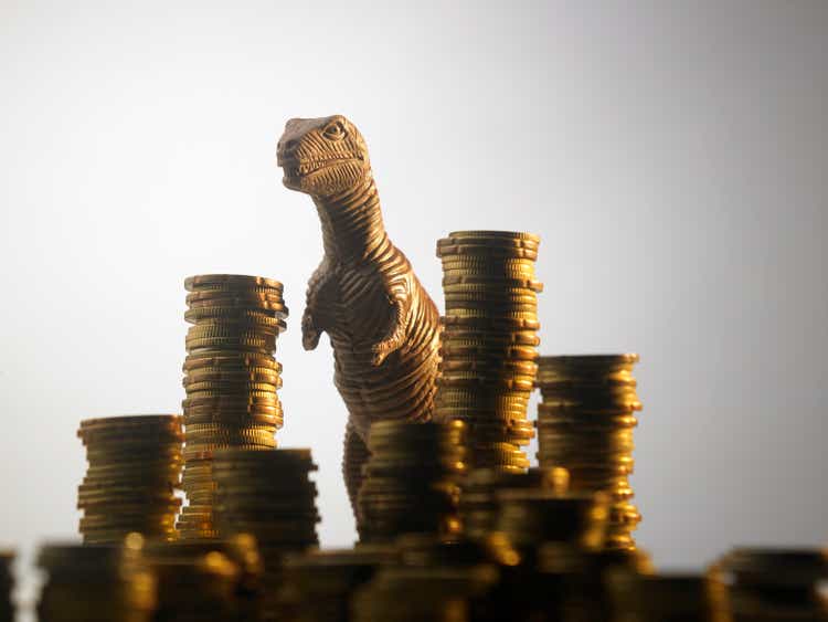 dinosaur many stack of coins
