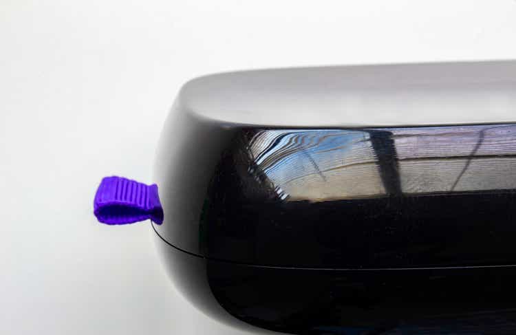 Front left view of a Roku box on a white background