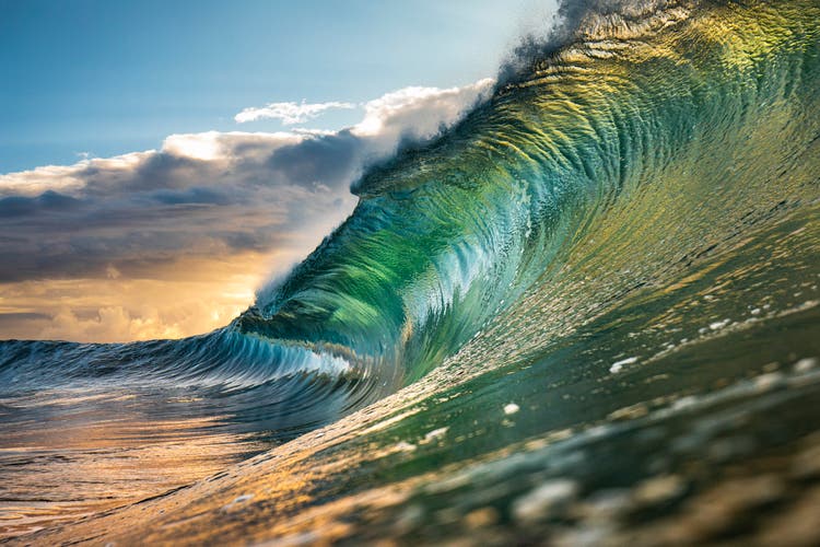 Powerful green wave breaking heavily in ocean