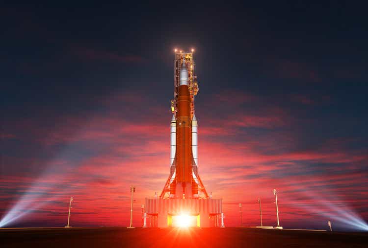 Space Launch System On Launchpad Over Background Of Sunrise