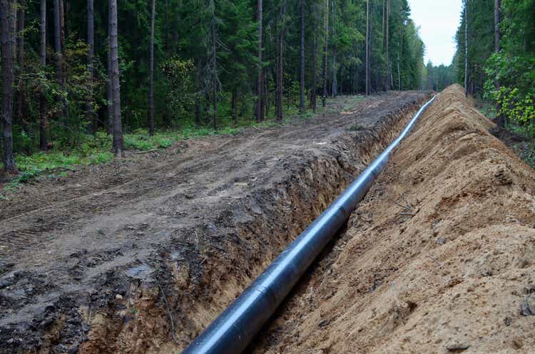 Natural gas pipeline construction work. A dug trench in the ground for the installation and installation of industrial gas and oil pipes