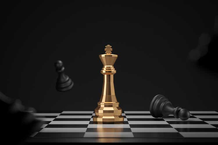 Golden chess piece on dark background with winner or victory concept. King of chess and competition ideas. 3D rendering.