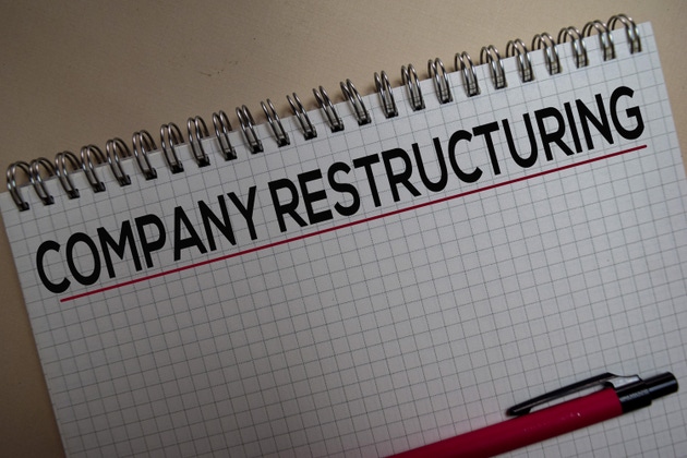 Company restructuring on book. Business and finance concept.
