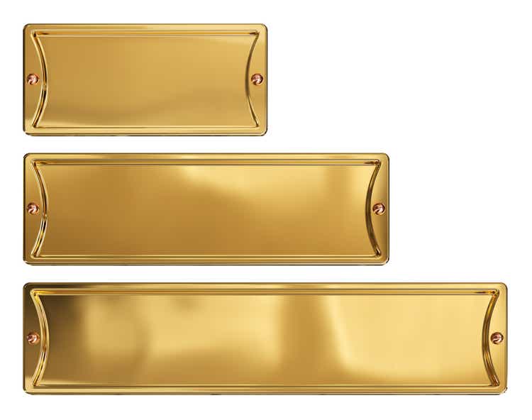 Empty gold or brass metal plates set, isolated on a white background. Clipping path included.