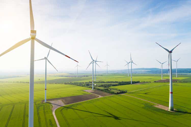 Aerial view of wind turbines and agriculture field