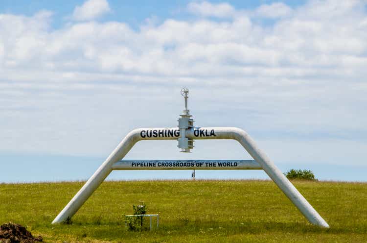 A sign made out of pipe and valves outside of Cushing OK Pipeline crossroads of the world where most WTI oil in the US is stored and traded