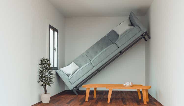 Concept of an apartment or living room that is too small to fit a sofa