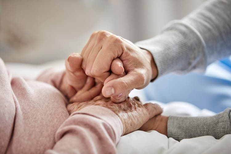 Caregiver supporting woman during corona outbreak