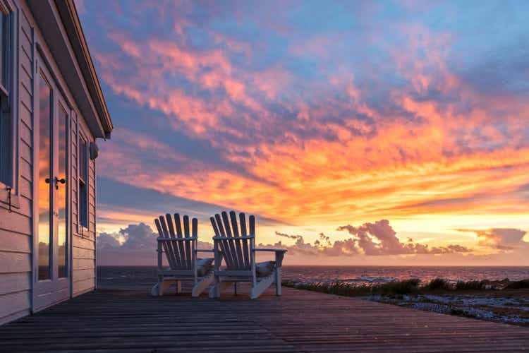 Two Ampty Chairs Facing Magnificent Sunset View at Beach