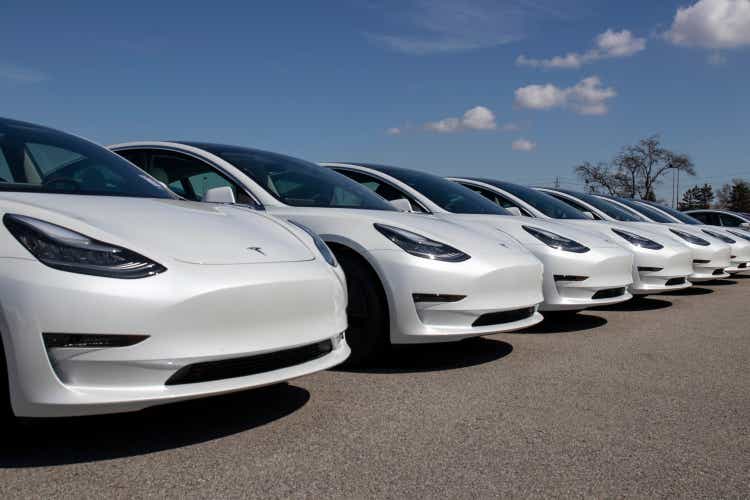 Tesla electric cars waiting to be prepared for sale.  The Tesla EV Model 3, S, and X are key to a cleaner, greener environment.