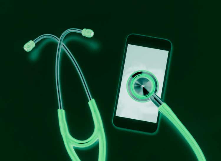 Telemedicine, stethoscope connecting to a smart phone online to connect to a healthcare professional to diagnose a health condition.