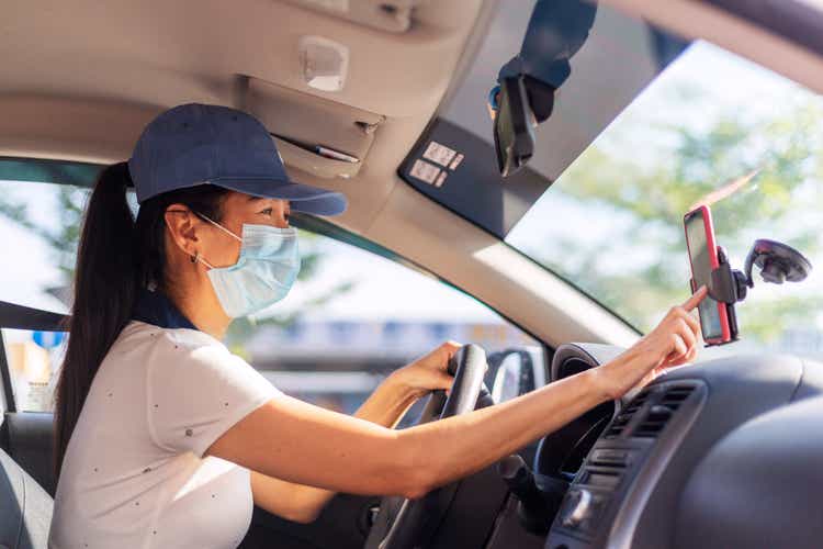 Hardworking Woman Driving Car for Rideshare