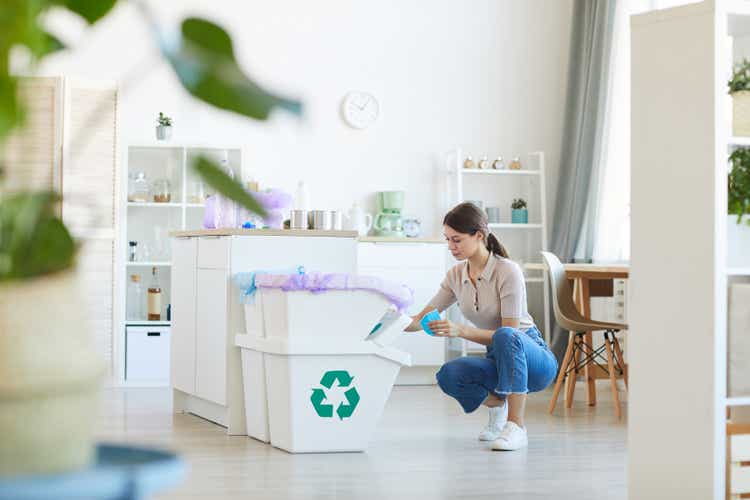 Woman sorting the paper waste