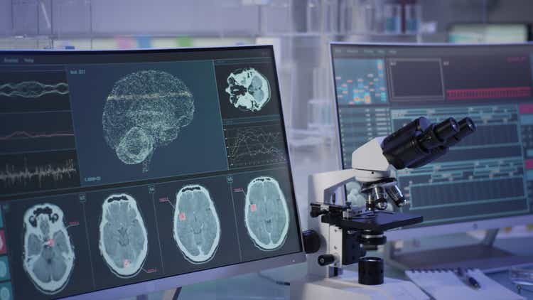 Futuristic laboratory equipment. Brainwave scanning research on computer screens