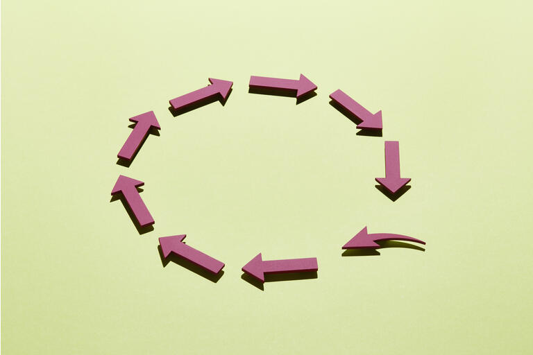A group of arrows arranged in a circle with one arrow filling a gap
