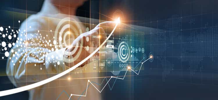 Businessmen point to arrows and business growth graphs on a modern virtual interface on global network, Banking, Stock market and currency exchange.