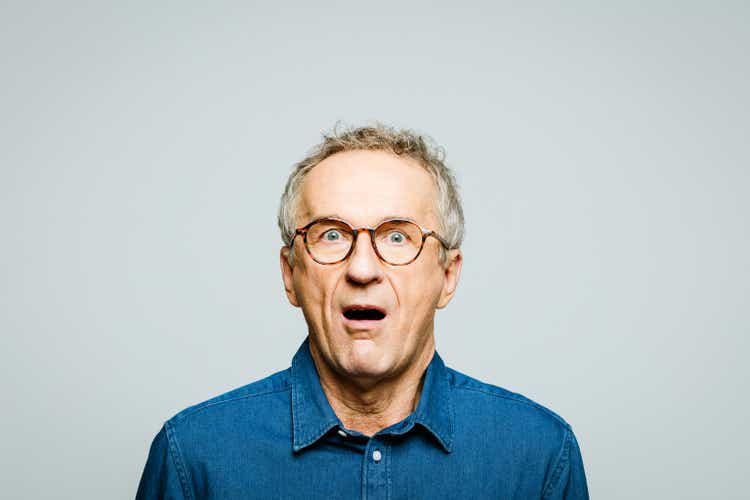 Portrait of shocked senior man