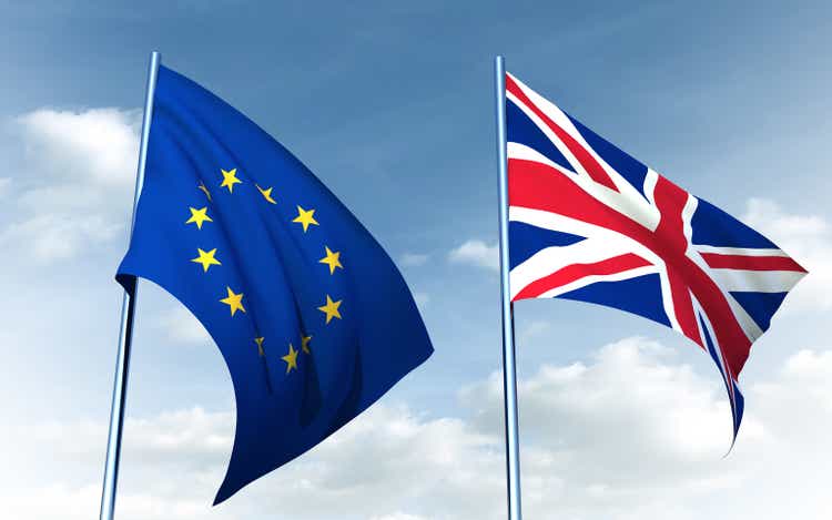 Brexit concept. British flag and EU flag on a sky background