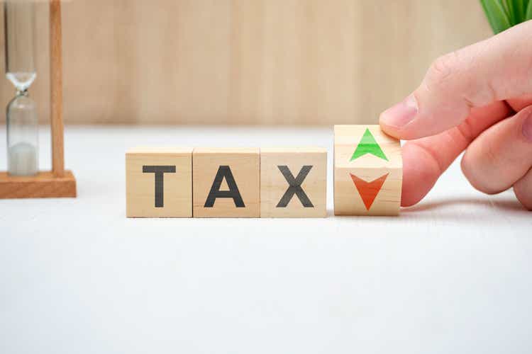 Tax concept with up and down arrows.
