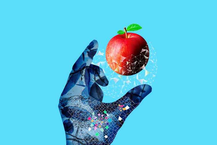 Cyborg"s hand, light and apple