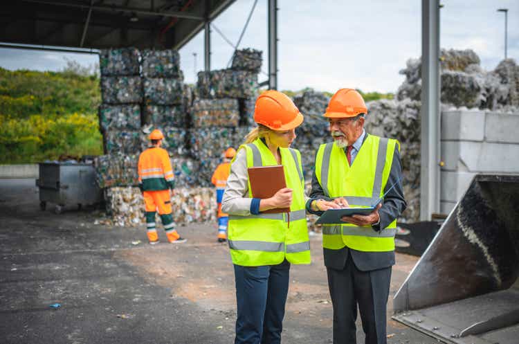 Quality control inspectors at a waste management plant