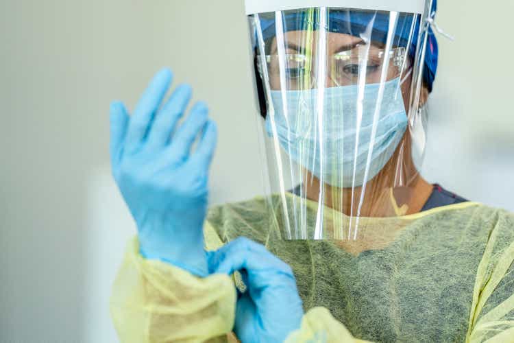 Hispanic female medical professional in personal protective equipment