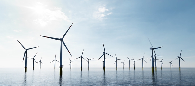 Offshore wind turbines farm on the ocean. Sustainable energy