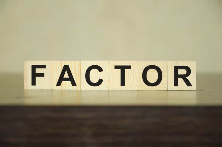 text factor written on wooden cubes. risk factors. evaluation of sales factors