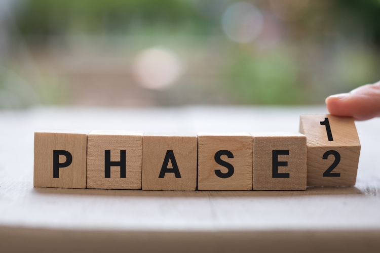 PHASE 1 2 reopen project plan concept on wood blocks as finger changes phase