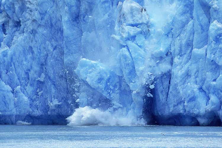 Alaska glacier, ice cubes falling into the ocean, symbol of global warming