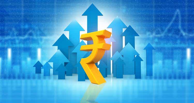 Indian rupee sign with stock market graph background