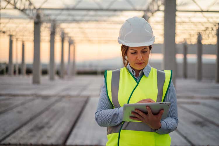 Female construction engineer using tablet