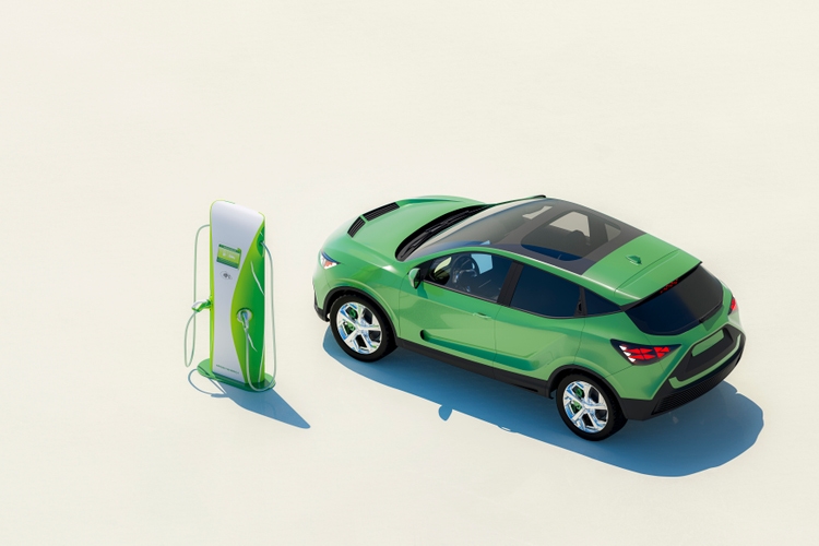 Modern electric car with electric charging station