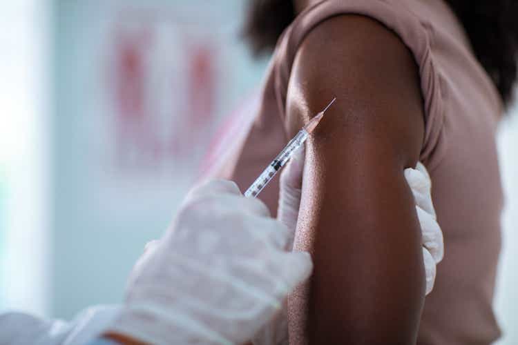 Young woman getting vaccinated