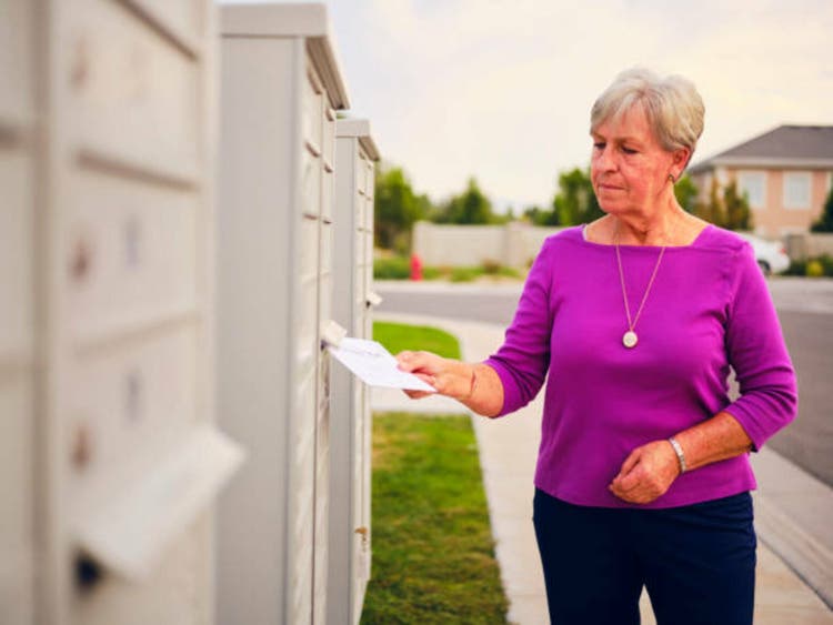 Senior Age Woman Voting by Mail