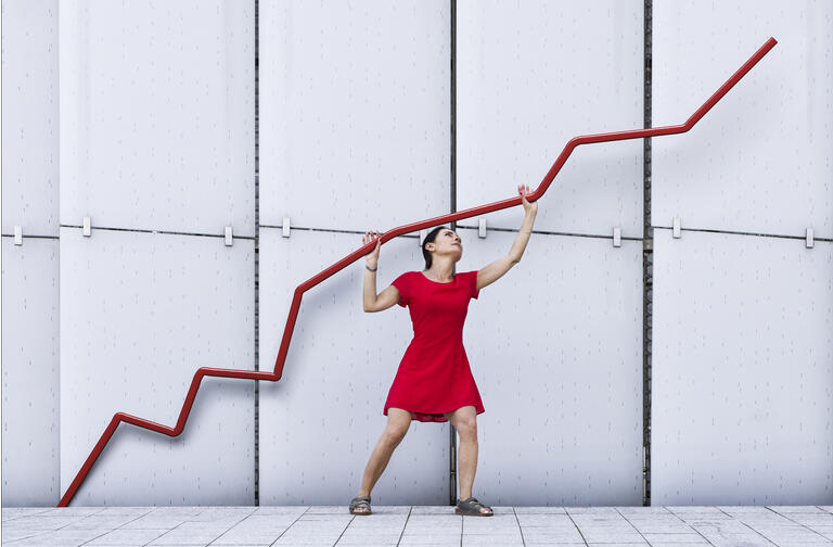 Woman holding up graph