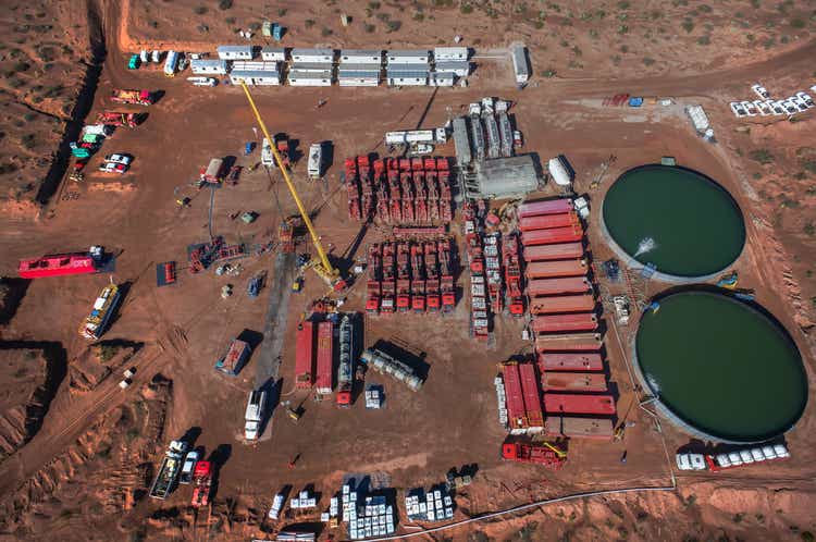 Vaca Muerta, Argentina, August 26, 2014: Extraction of unconventional oil. Battery of pumping trucks for hydraulic fracturing (Fracking).