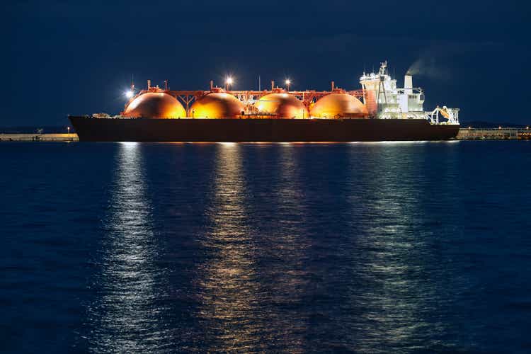 Picture of LNG tanker in port at night.
