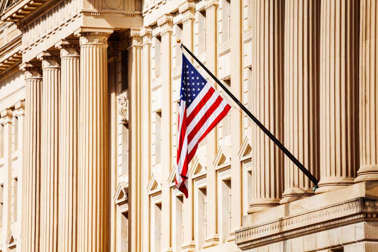 American flag on top of government buildings in Washington DC