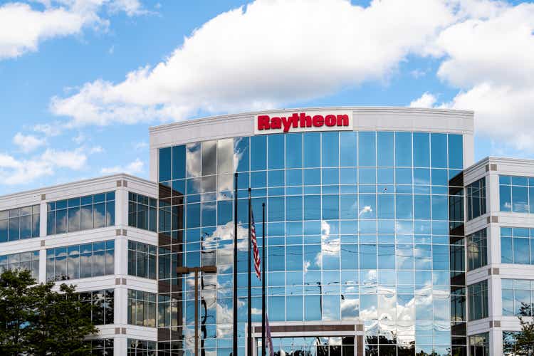 Raytheon corporation corporate office entrance sign in Northern Virginia with American flag