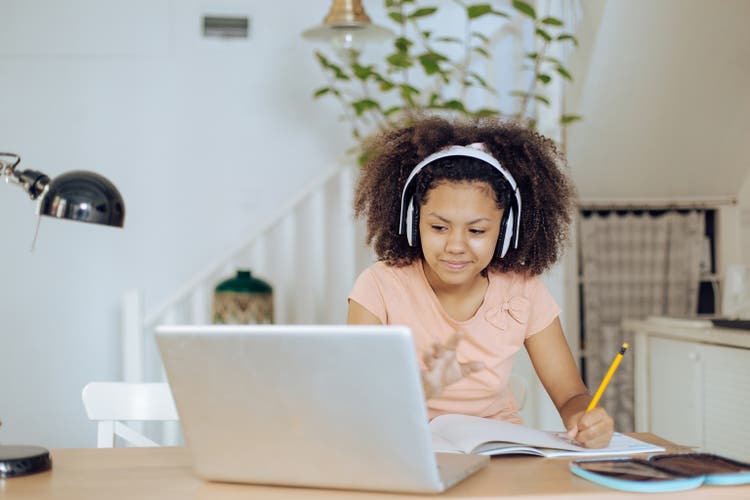 Teenage African-American girl learning at home