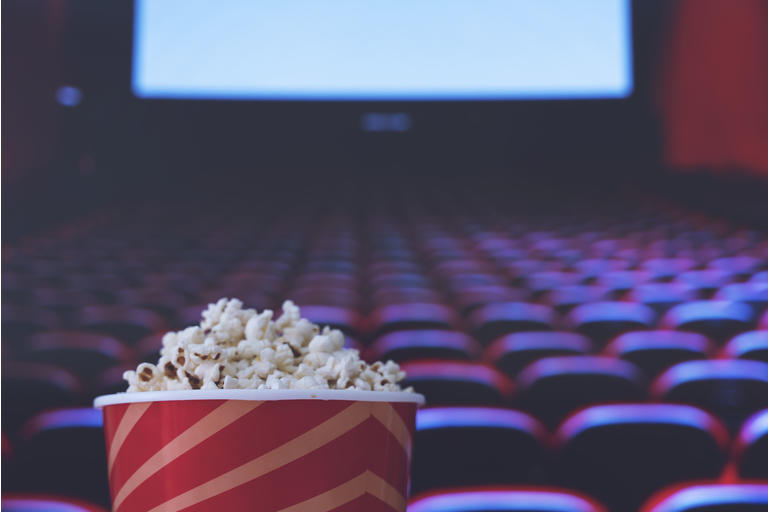 pop corn and on red armchair cinema