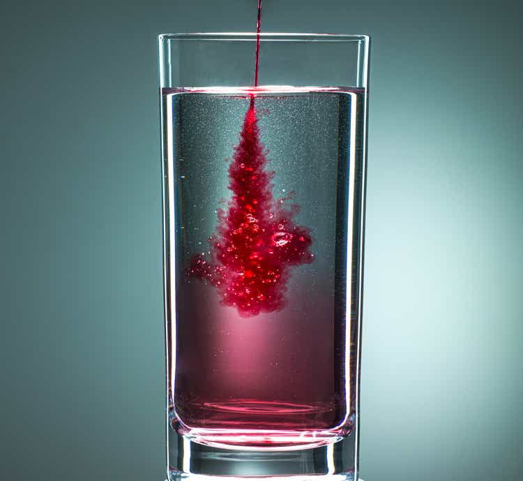 Red liquid in drinking glass