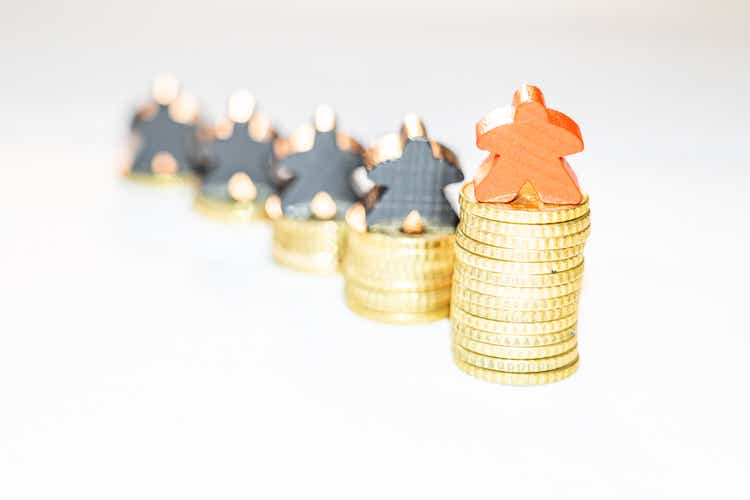 illustration of outperformance in economy with piles of ten cent coins and wooden meeples on white background
