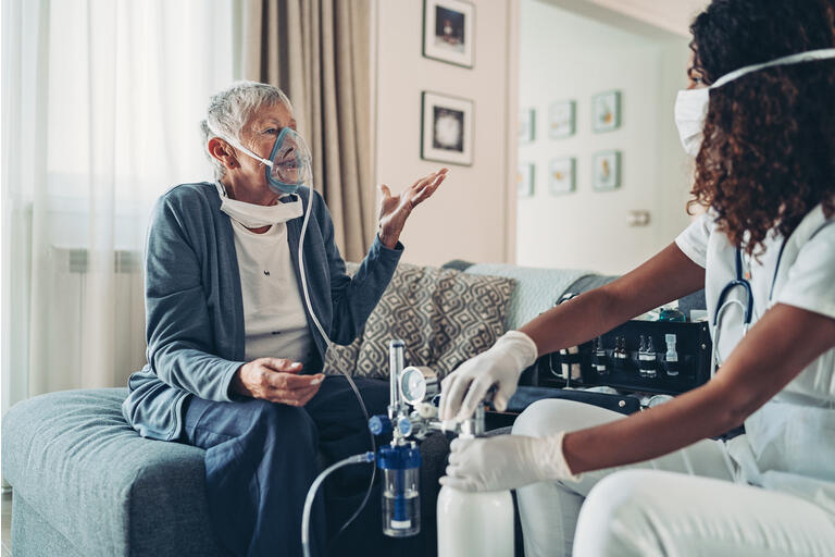 Elderly woman needing breading device